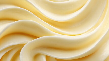 Delicate closeup of creamy butter or margarine in elegant swirling texture, ideal for food, dairy, or cooking themes.