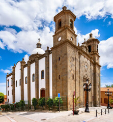 Side view of Church of San Sebastián in Agüimes, Gran Canaria under blue sky and sunshine. Spain