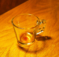 glass dirty cup on wooden table background