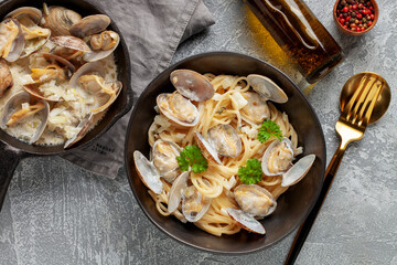 Seafood pasta with clams. Spaghetti alle Vongole on a light background. Top view