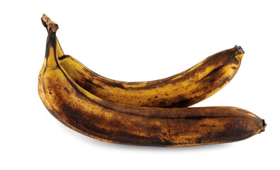 Two overripe bananas with blackened peel isolated on white background.