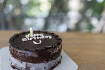 Happy birthday written on chocolate cake. Close up