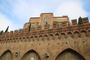 View of the Basilica of San Domenico and the source of Fontebranda, in Siena, Italy.
