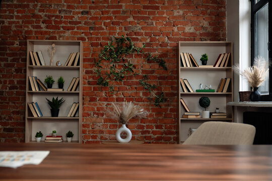 Cozy Reading Space with Brick Wall and Bookshelves