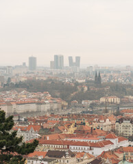 Obraz premium Prague skyline with modern towers and old rooftops