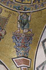 Mosaic telamon figure supporting decorative element in Florence Baptistery apse vault, medieval...