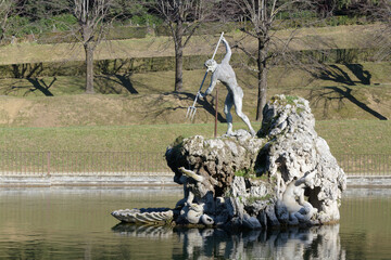 Neptune Fountain with trident and sea creatures by Stoldo Lorenzi, 16th-century Mannerist sculpture in Boboli Gardens, Florence, Italy. © dimamoroz