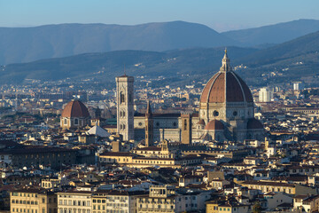 Panoramic view of Cathedral of Santa Maria del Fiore with Giotto's Campanile and city rooftops in...