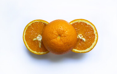 Three orange halves on white background, top view, close-up