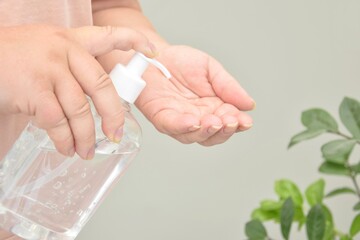 Woman Using Alcohol Gel, Hand Sanitizer