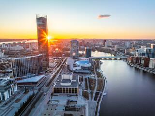 Yekaterinburg aerial panoramic view in spring at sunset. Yekaterinburg city and pond in spring or...