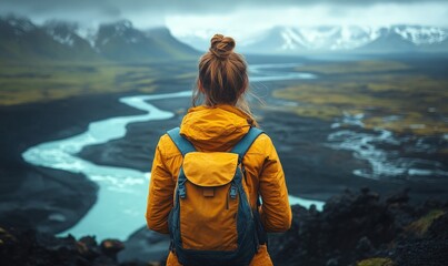 Woman hiker admires Icelandic landscape