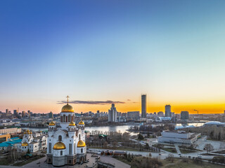 Early spring or autumn Yekaterinburg and Temple on Blood in clear sunset. Aerial view of Yekaterinburg, Russia. Translation of the text on the temple: Honest to the Lord is the death of His saints.
