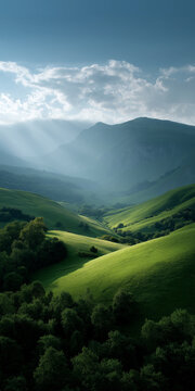 Serene mountain landscape with sunlit rolling green hills and dramatic clouds