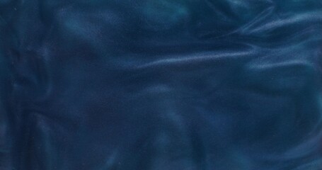 Abstract background. Dark blue liquid with sparkles shimmers