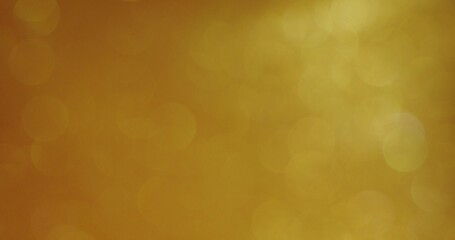 Abstract background. The golden sequins are bubbling and shimmering. Blurred boho sequins