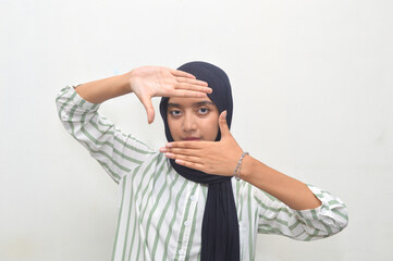 Asian girl wearing black head scarf or hijab in white clothes isolated on white background