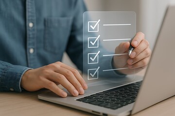 Person completing digital checklist on laptop