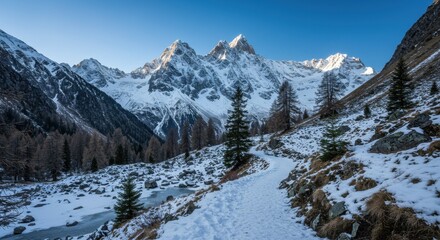 Snowy mountain range landscape with pathway