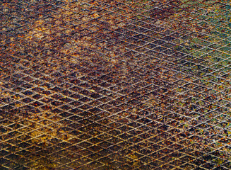 Rusty metal surface with diagonal grid texture. Weathered industrial background with corrosion,...