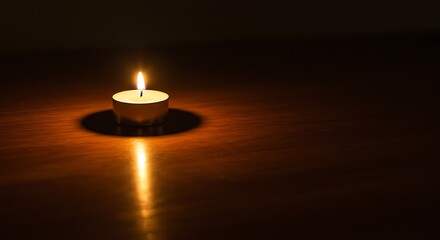 Single Candlelight Glowing in the Dark A Peaceful and Serene Atmosphere
