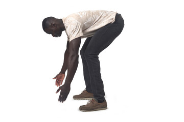 Naklejka premium side view of a man lifting something imaginary, large or heavy from the ground on white background