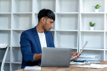 Fototapeta premium Focused Businessman Working at Desk