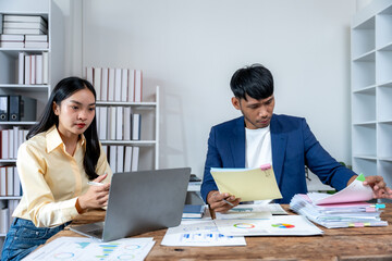Business Professionals Analyzing Financial Documents