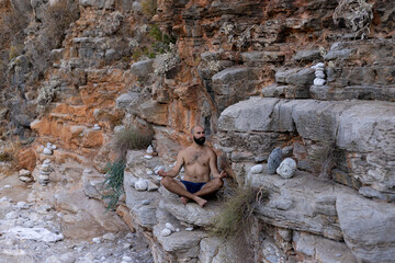 man yoga mountain views