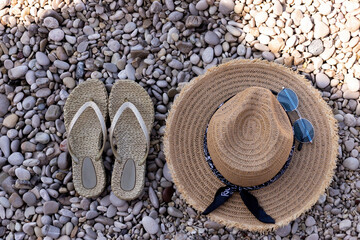 Travel vacation concept with flip flop sandals and beach staw