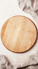 Beautiful wooden round plate on a textured surface, perfect for food presentation or culinary styling in photography, capturing a rustic and earthy aesthetic vibe.
