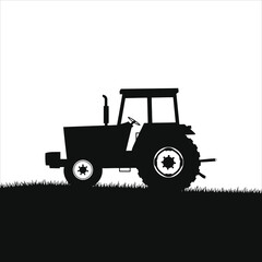 Vector Silhouette of a Tractor in a Field/A clean, black silhouette of a tractor is set against a white background.