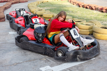 happy brunette women wining the karting race.