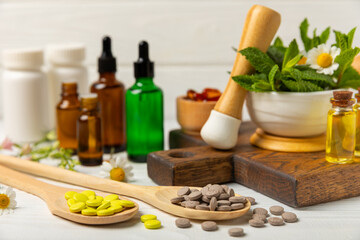 Alternative medicine herbal capsule organic drug on wooden background.Assortment of herbal and tablets,vitamins and dietary supplements.medicinal and Healing herbs.natural supplements for healthy life