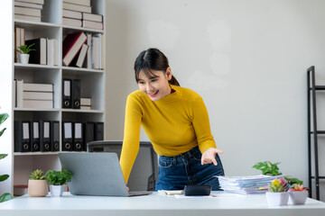 Cheerful Asian Woman Working from Home