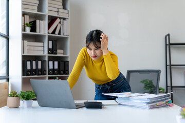 Stressed Woman Working at Desk with Laptop