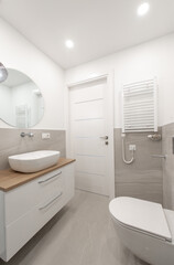 Modern Home Minimalist Bathroom Interior With Wooden Vanity and Sleek Wall Fixtures