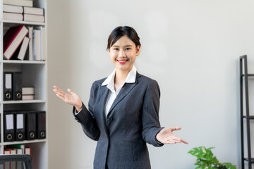 Confident Asian Businesswoman Presenting