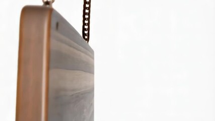 Teak wood rectangular signboard swinging with metal chains on a white background, showing wood texture and grain.