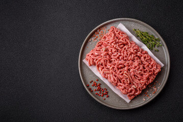 Raw ground beef or pork as an ingredient for burgers. Raw minced meat