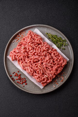 Raw ground beef or pork as an ingredient for burgers. Raw minced meat