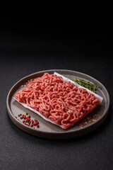 Raw ground beef or pork as an ingredient for burgers. Raw minced meat