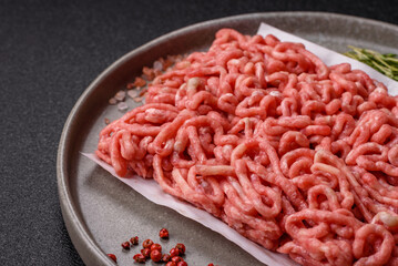 Raw ground beef or pork as an ingredient for burgers. Raw minced meat