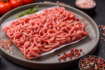 Raw ground beef or pork as an ingredient for burgers. Raw minced meat