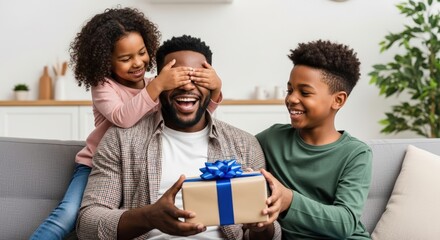 A happy father receives a surprise gift from his children, filled with joy and laughter.