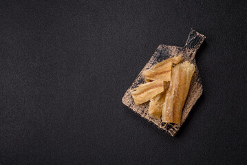 Dried salted fish, snacks or jerky, slices of white fish fillets