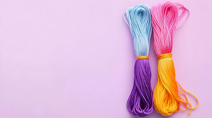 Colorful Yarn Bundles On Pastel Pink Background