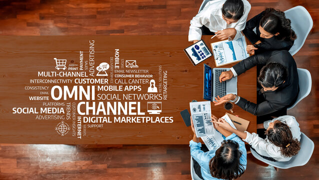 A dynamic group of professionals engaging in a collaborative meeting focused on omni-channel marketing strategies, analyzing data and technology solutions for business growth. Amity