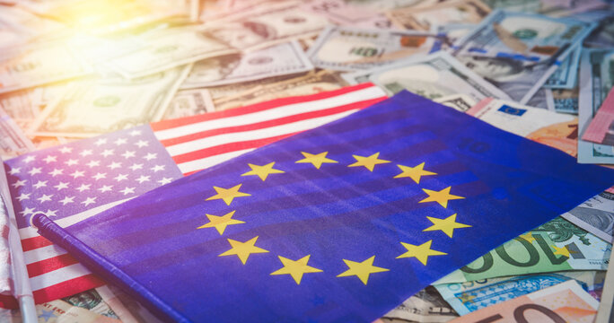 US Dollar and Euro on flags of the United States and European Union.