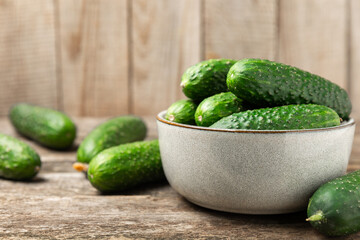 Cucumber on wooden background. Slice of cucumber on background. Fresh organic green cucumbers...
